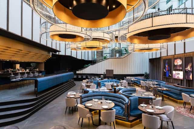 Foyer of Radisson Collection Hotel, Brussels with elegant chandeliers for events and dining.