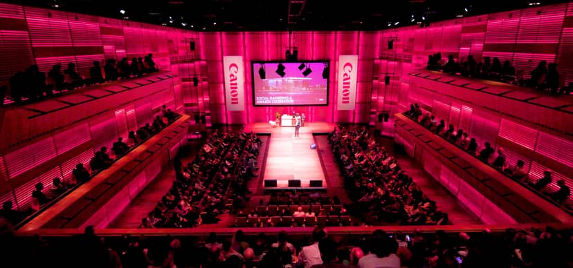 Vibrant event space in Muziekgebouw with pink lighting for impactful conferences.