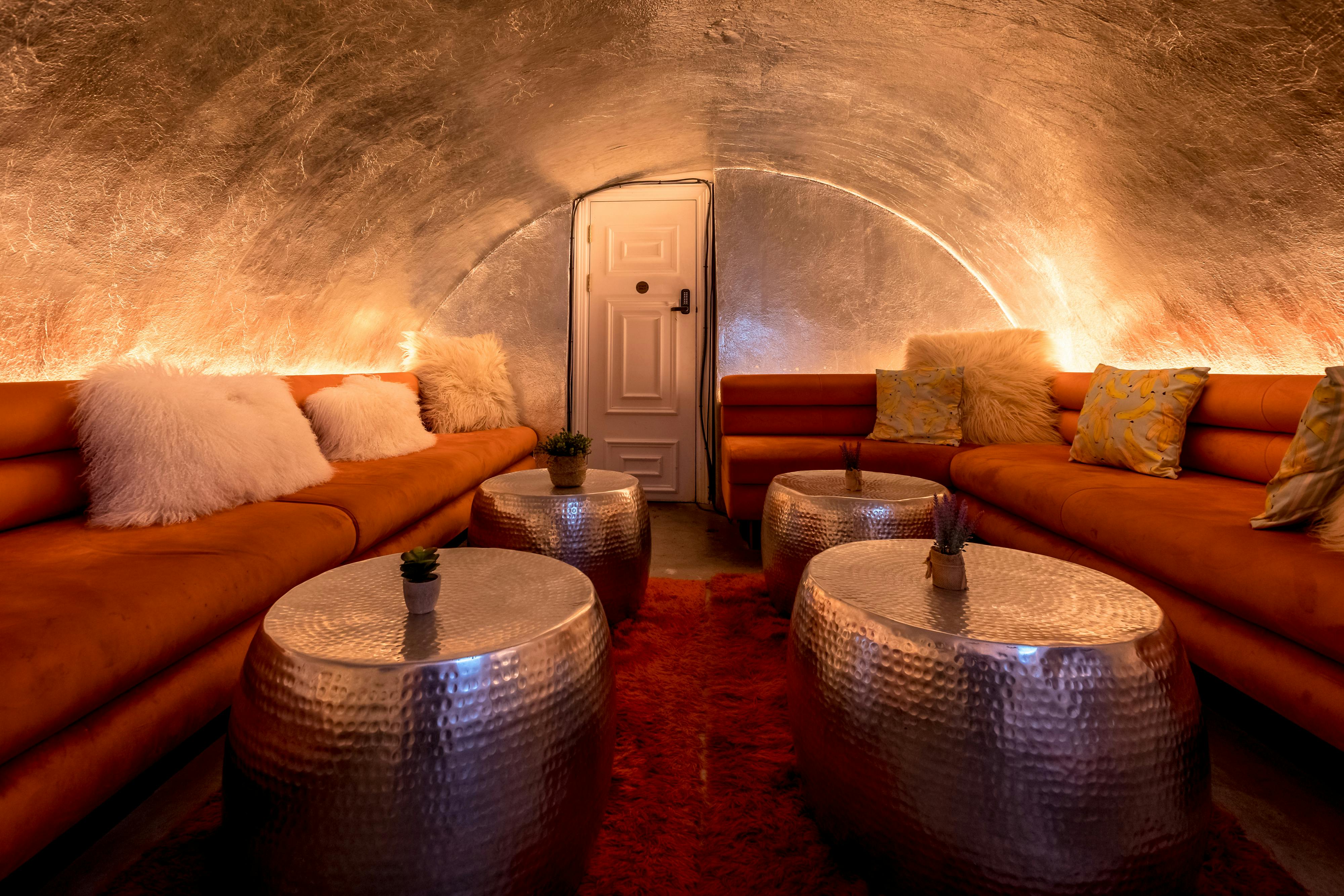 Intimate lounge at The Vault, warm lighting, perfect for gatherings and events.