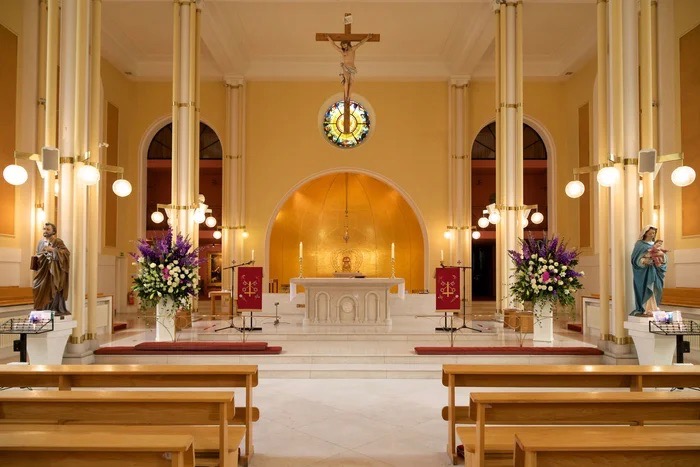 Elegant church meeting room with altar, perfect for weddings and ceremonies. - Banner