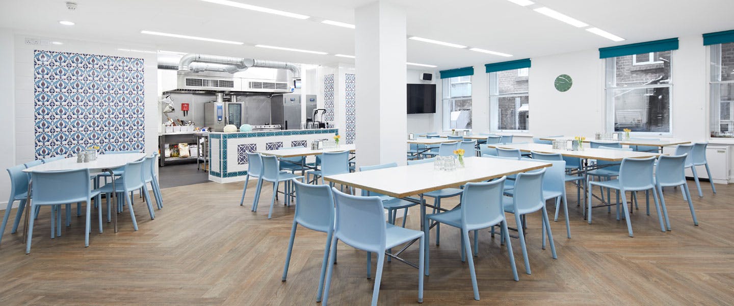 Modern event space with open kitchen for meetings and gatherings in Covent Garden.