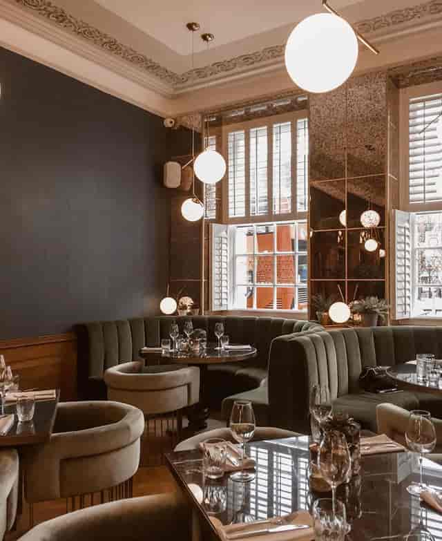 Stylish Masons Restaurant Bar with plush seating, ideal for intimate meetings and events.