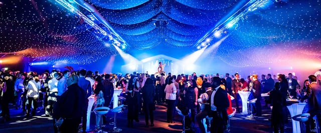Vibrant event space at The Marquee, elegant draping, perfect for networking and entertainment.