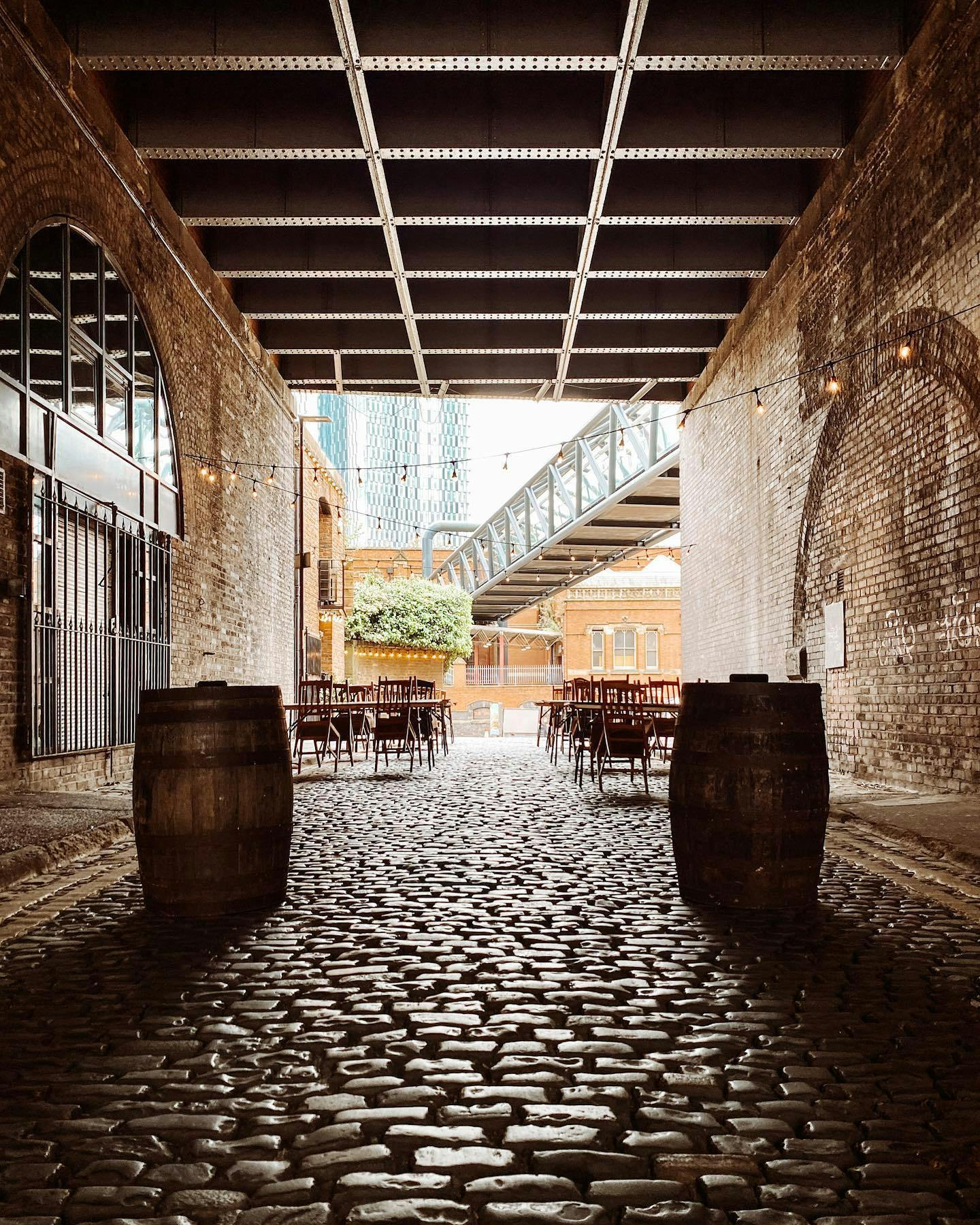 Charming outdoor venue at Lock 91 with cobblestone floor, ideal for events and gatherings.