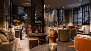 Stylish Dakota Bar lounge with warm lighting, perfect for networking events and meetings.