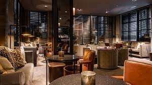 Stylish Dakota Bar lounge with warm lighting, perfect for networking events and meetings.