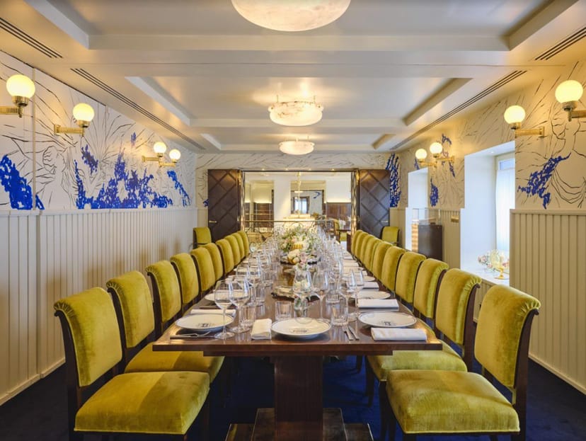 Elegant meeting space with yellow chairs, perfect for corporate events and upscale dining.