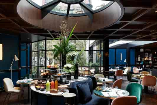 Privatized Le Roch Hotel restaurant with elegant decor for brunch events and corporate meetings.