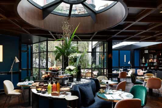 Privatized Le Roch Hotel restaurant with elegant decor for brunch events and corporate meetings.