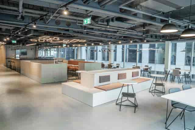 Modern business lounge with flexible seating for networking events and workshops.