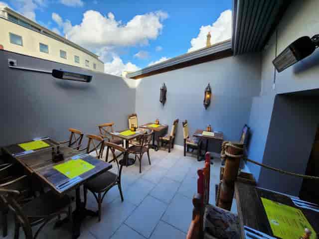 Cozy outdoor dining area at Desperados, perfect for gatherings and events.