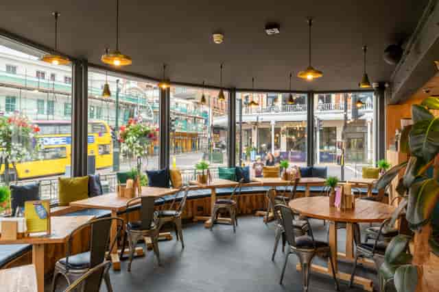 Stylish venue with large windows for casual meetings and networking events in Bournemouth.
