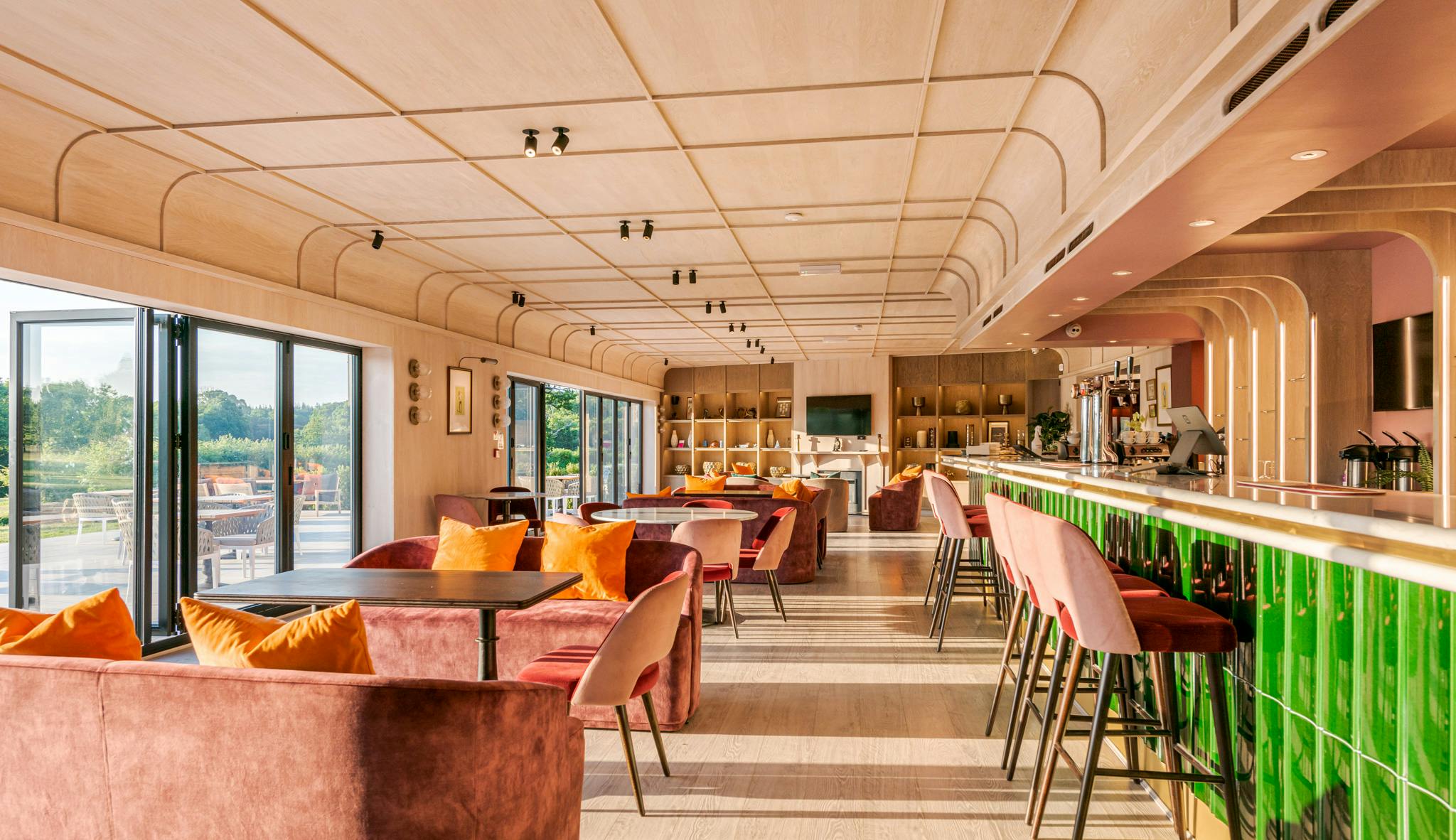 Modern event space at Hamptworth Golf Club with sleek bar, perfect for receptions and meetings.