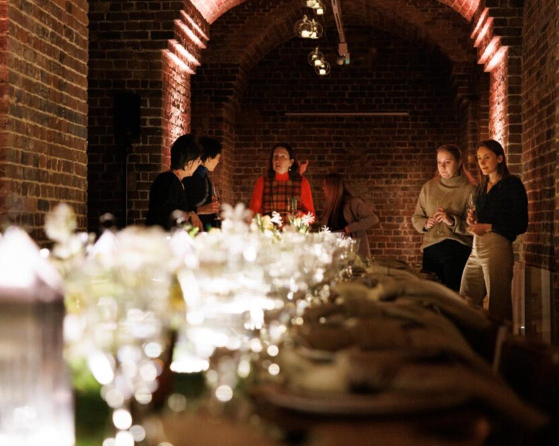 Stylish event setup in The Old Crypt, warm lighting for intimate gatherings and networking.