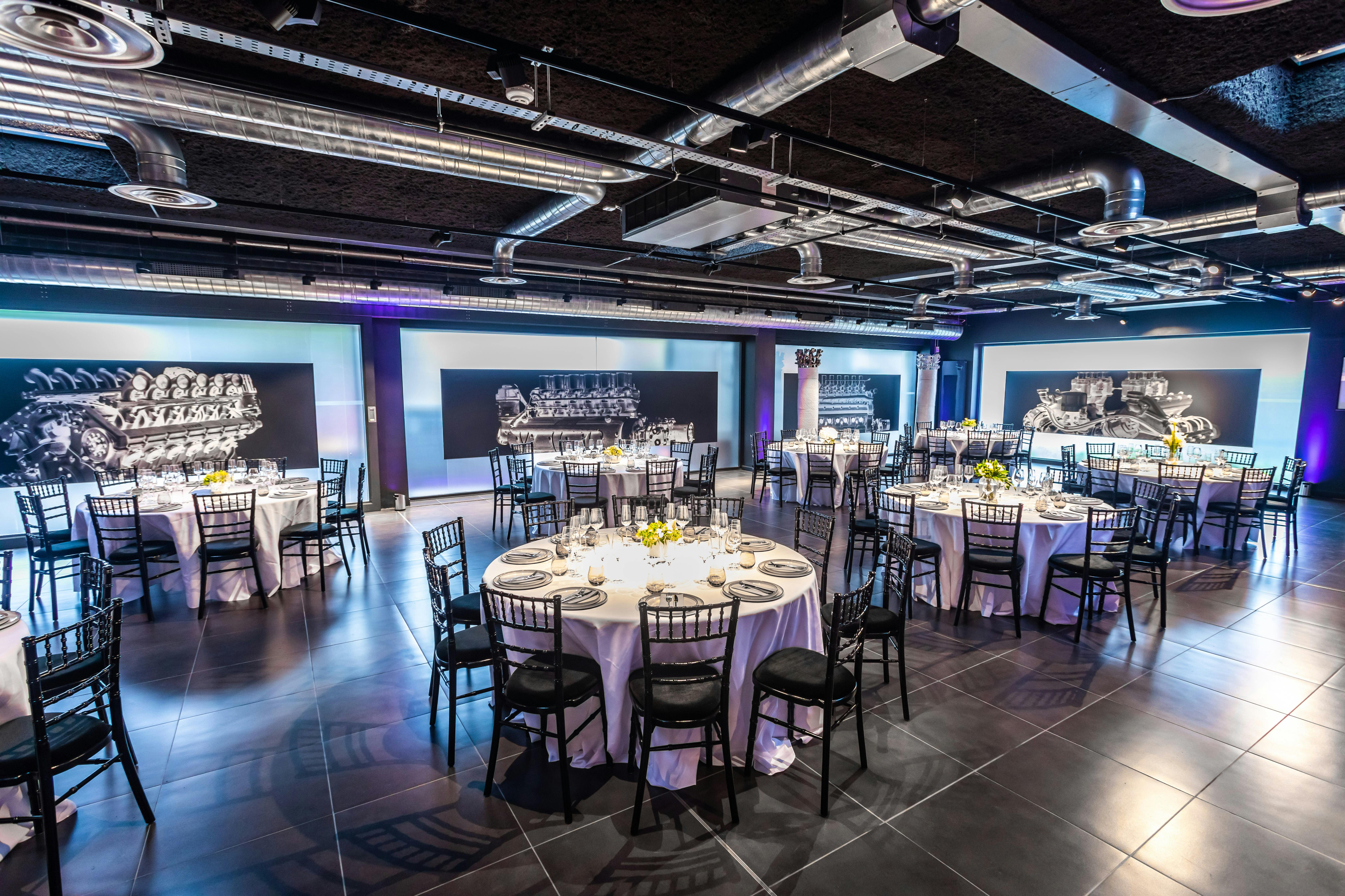 Elegant event space with round tables, ideal for networking and celebrations.
