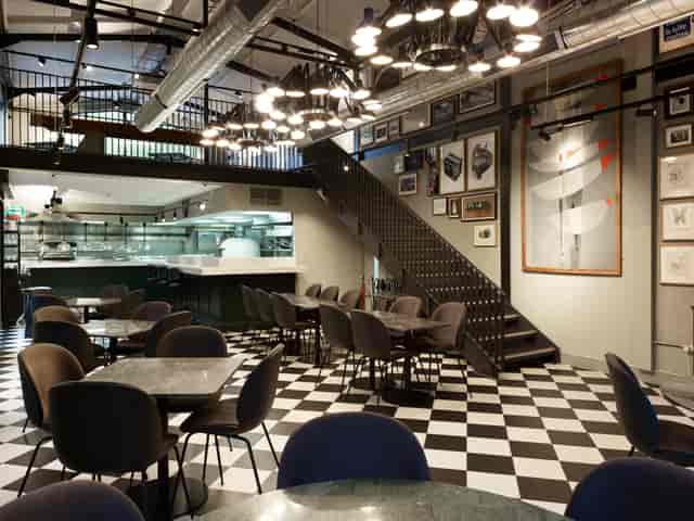Modern dining venue with chic decor for intimate gatherings and corporate events.
