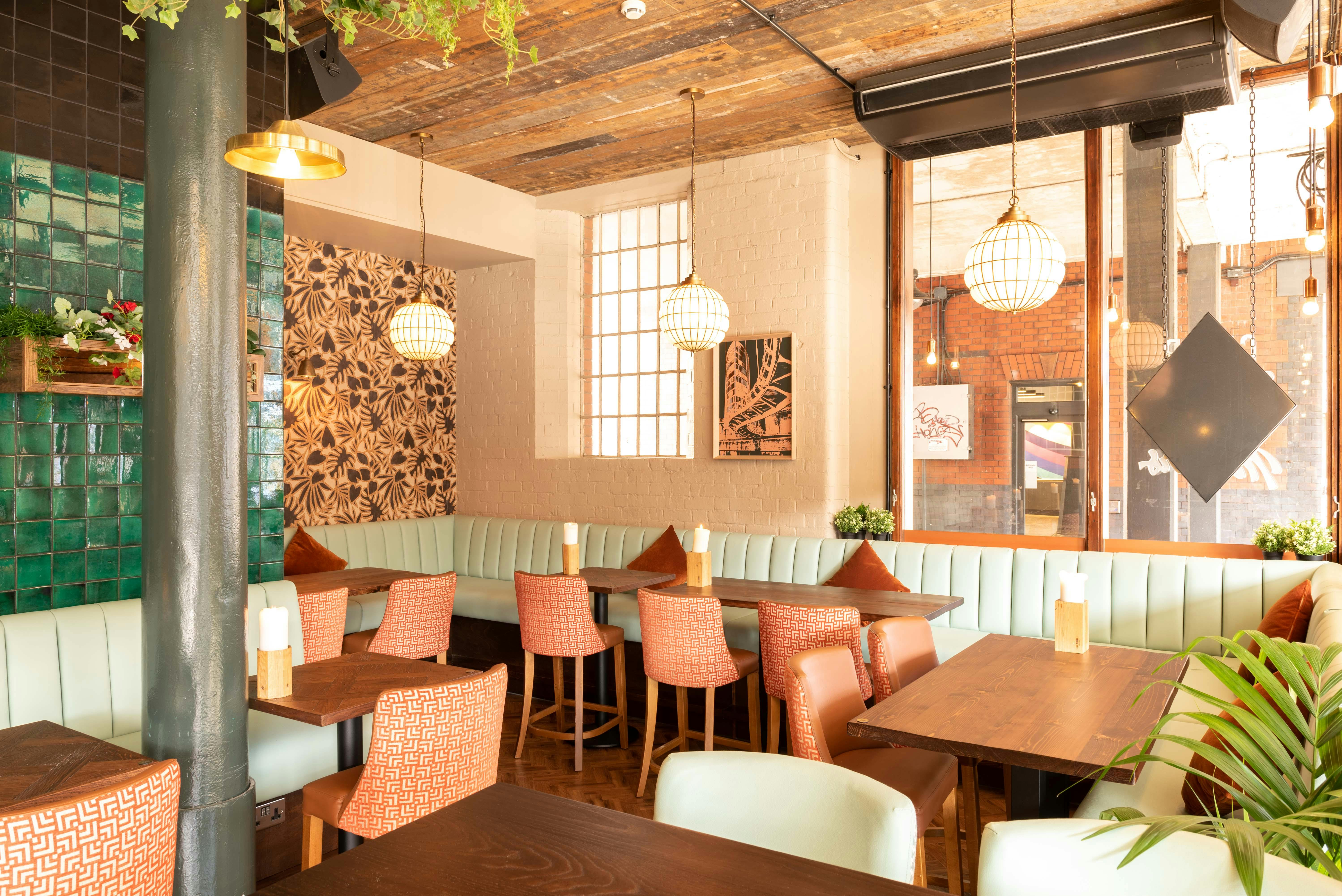 Stylish restaurant space with cozy seating for intimate meetings and small events.