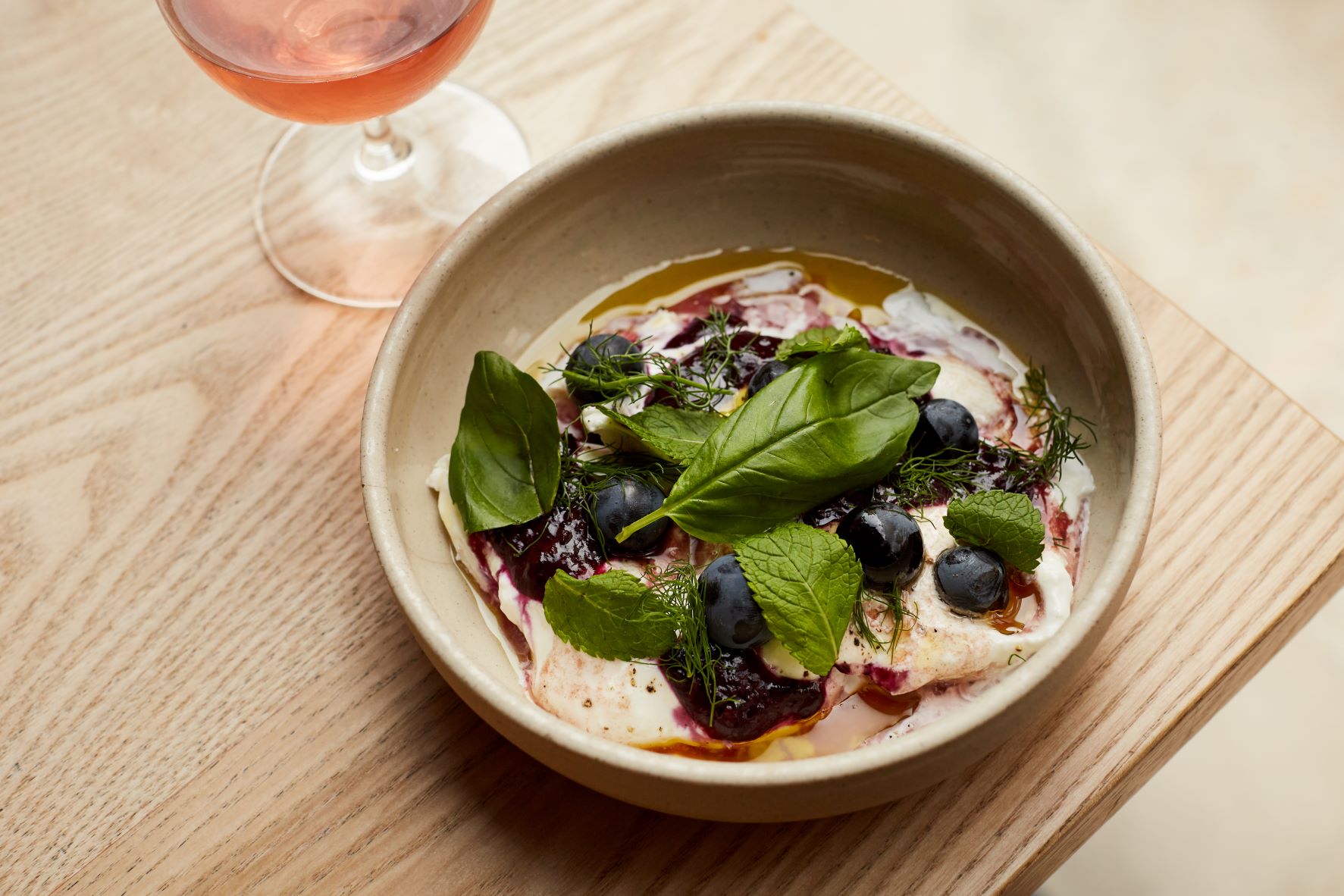 Elegant dish with blueberries and rosé at Crispin Pavilion for upscale events. - Banner