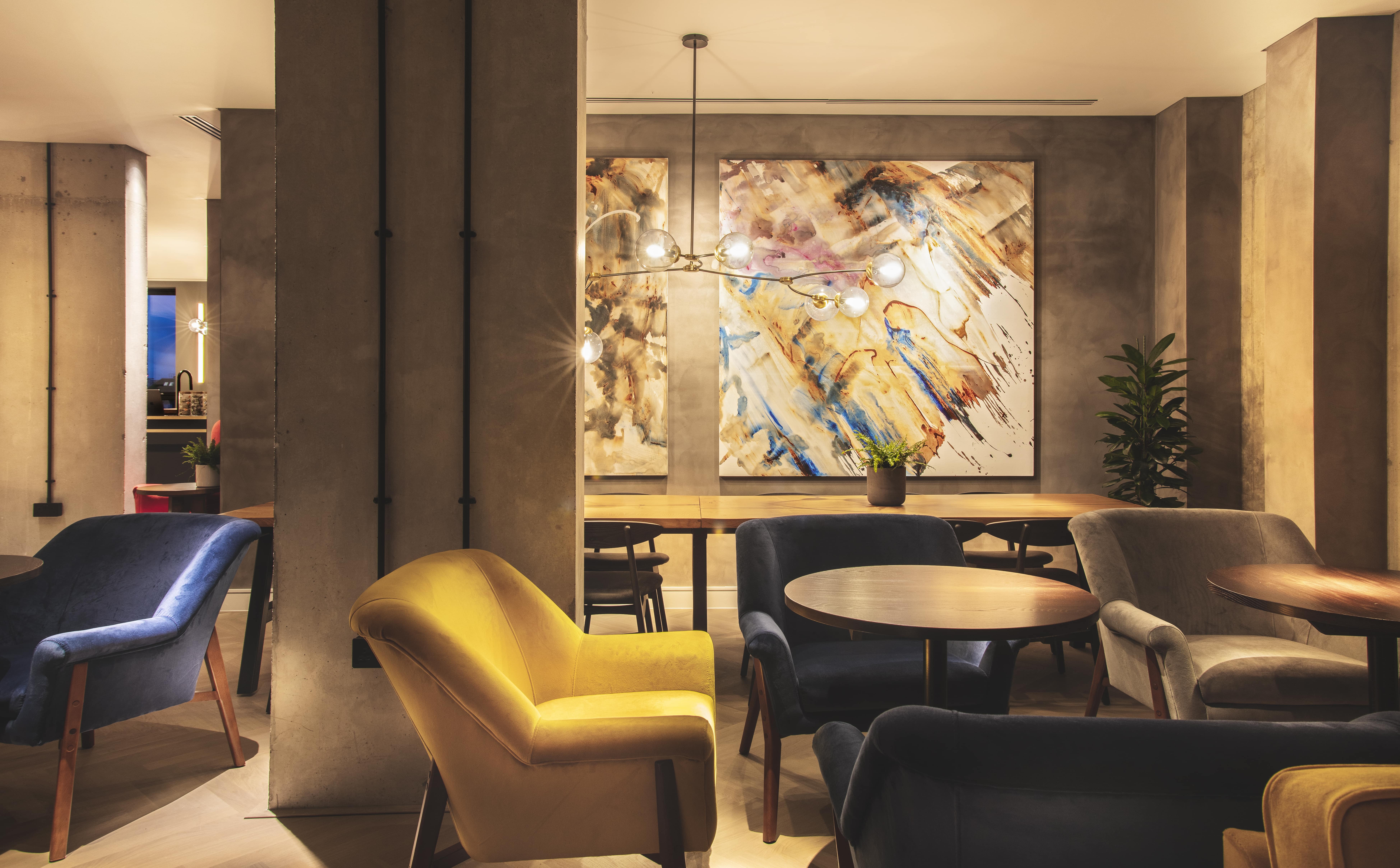 Modern meeting space with artistic decor at The Gate Aparthotel Aldgate East. - Banner
