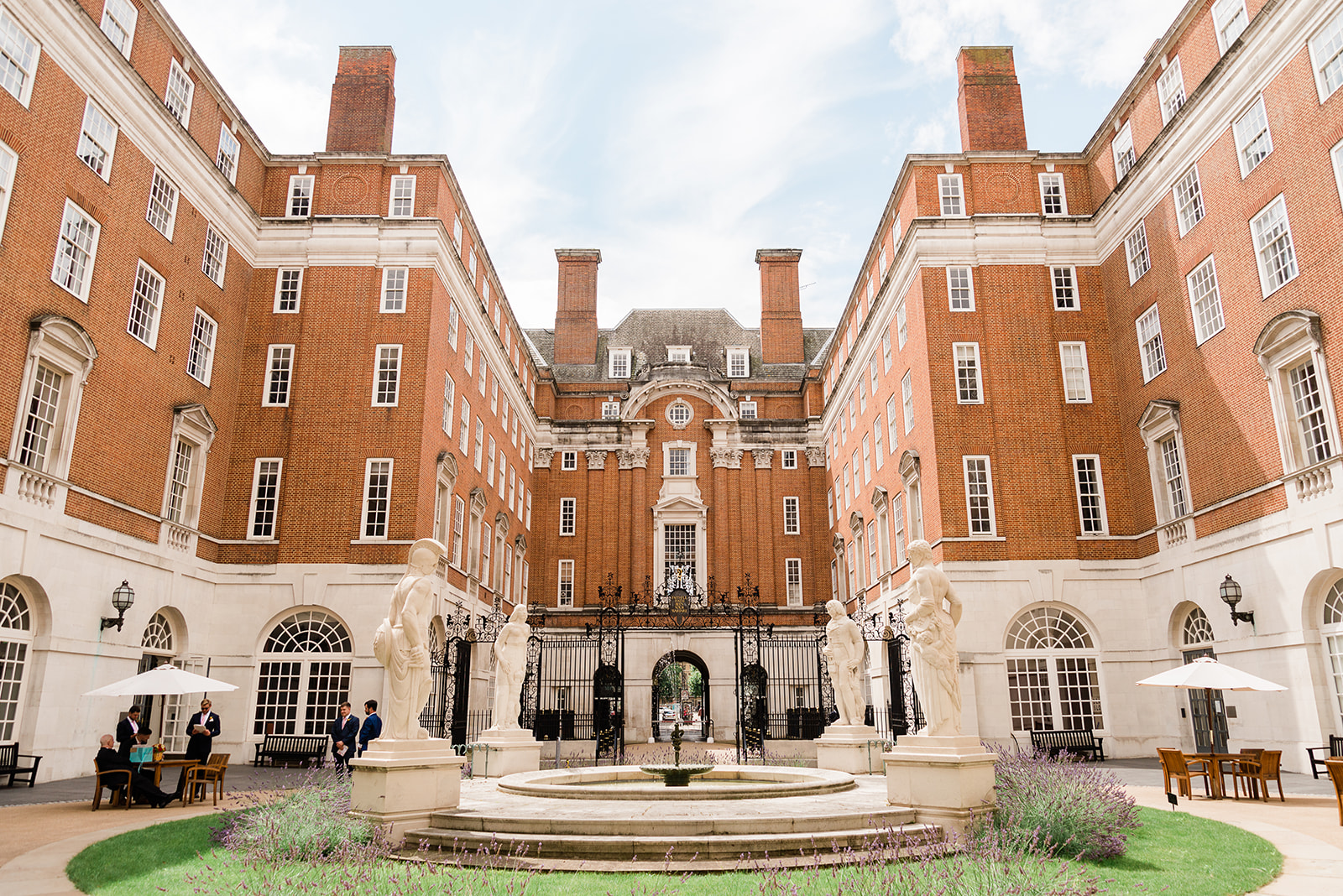 Stunning wedding venue at BMA House with elegant architecture and central fountain. - Banner
