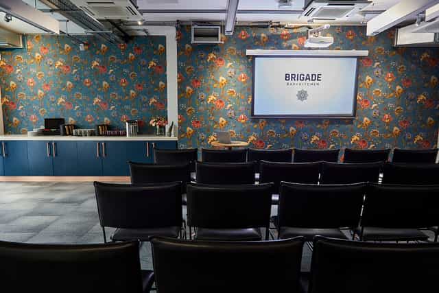 Covent Garden meeting space with floral wallpaper, ideal for presentations and brainstorming.
