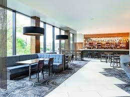Aspen Room at Bristol Holland House: modern venue with natural light for events and meetings.
