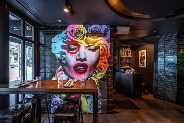 Vibrant venue with mural for creative corporate events and social functions.