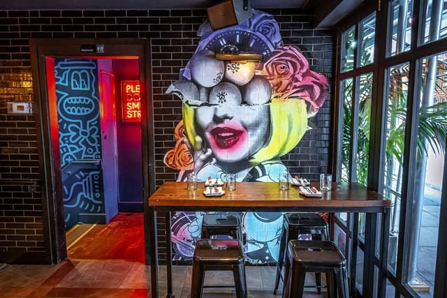 Vibrant Spin venue with striking mural, ideal for creative meetings and events.