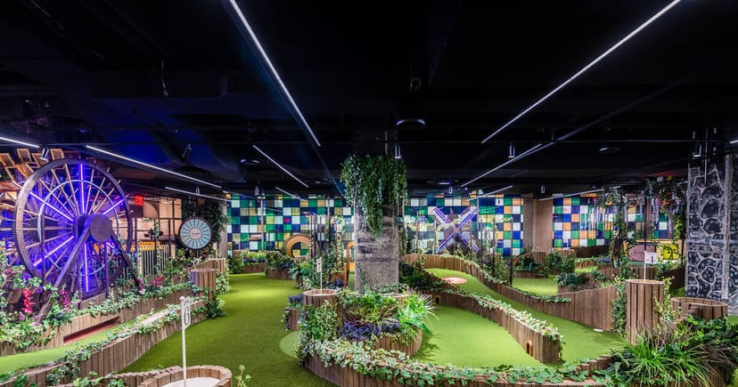 Vibrant event space with mini-golf for team-building and networking activities.
