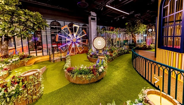 Vibrant Swingers venue with greenery, ideal for corporate events and social gatherings.