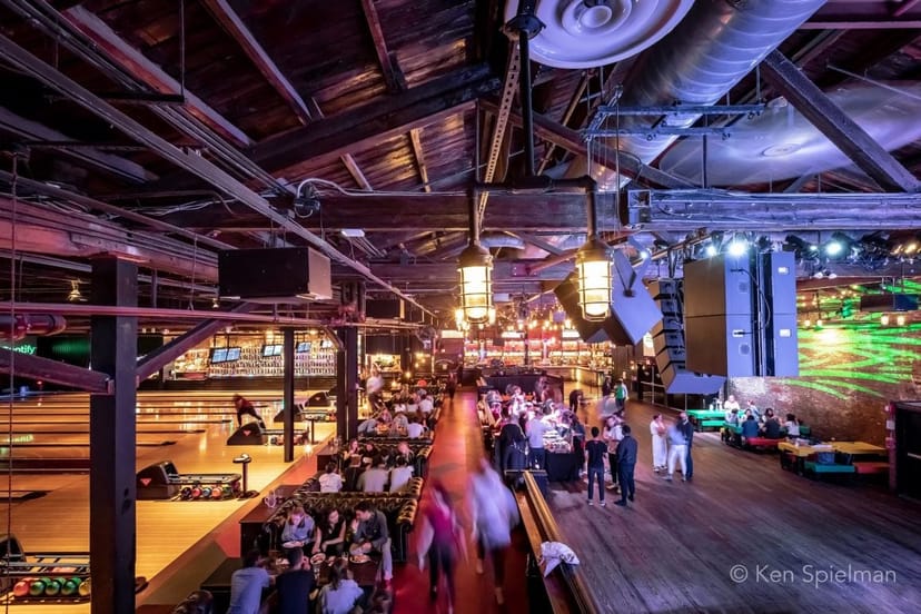 Vibrant Brooklyn Bowl venue with high ceilings for dynamic corporate and social events.
