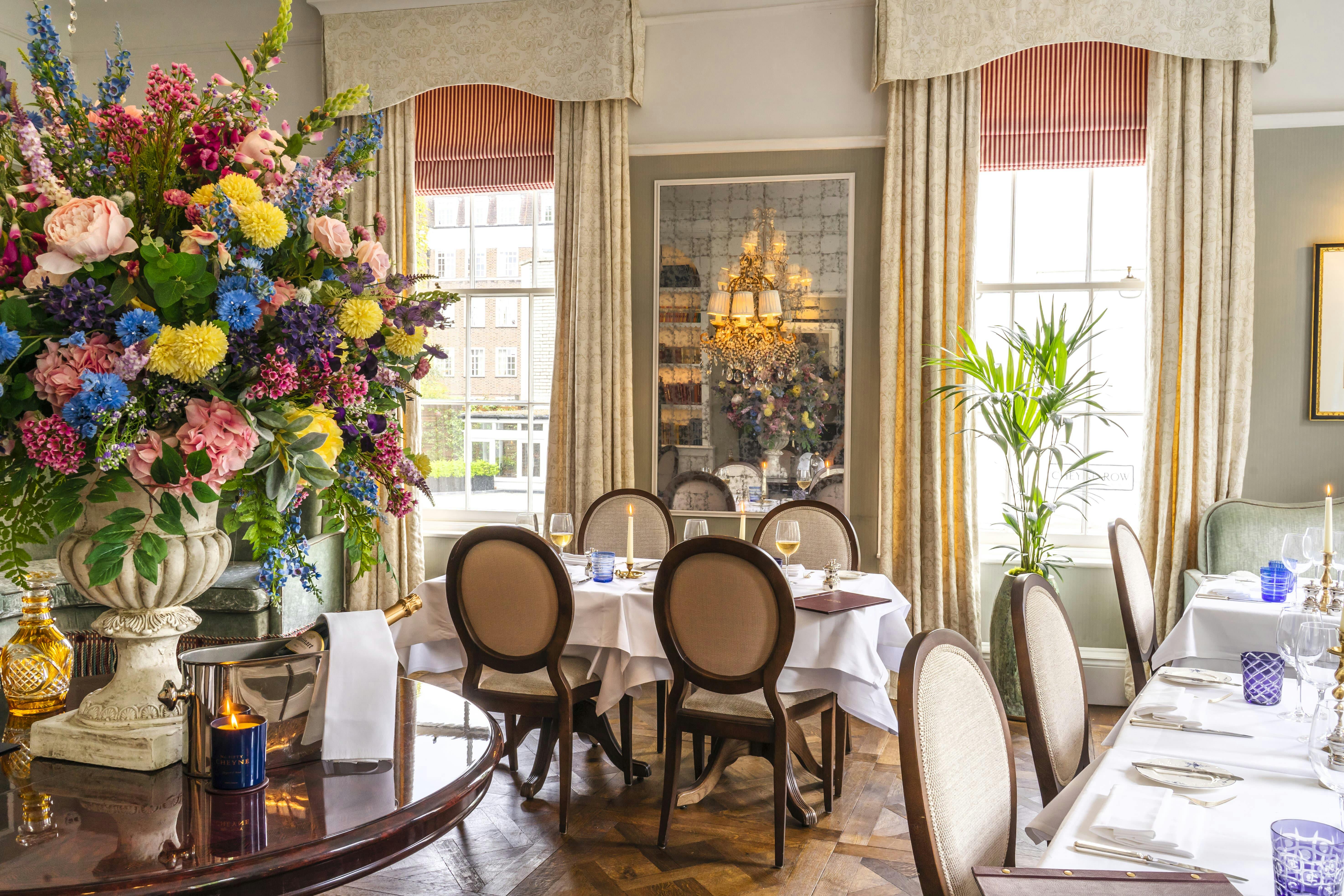 Elegant dining space at No. Fifty Cheyne with floral centerpiece for upscale events.