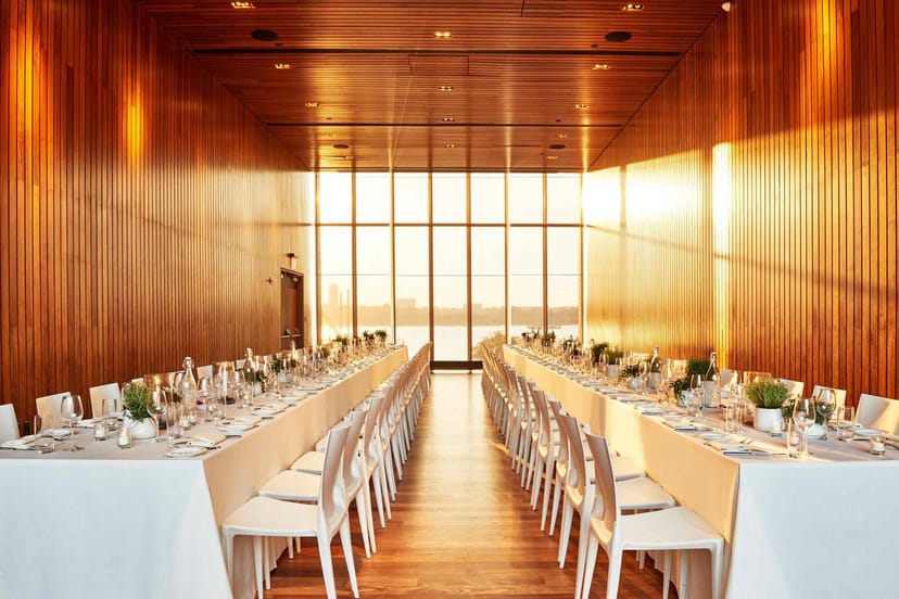 Biergarten Garden Room with elegant table settings for corporate meetings and social events.