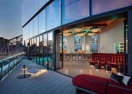 Panorama Room at Graduate Roosevelt Island: modern event space with stunning views for upscale gatherings.