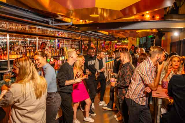 Golden Ticket bar scene with vibrant decor, perfect for networking events and meet-ups.