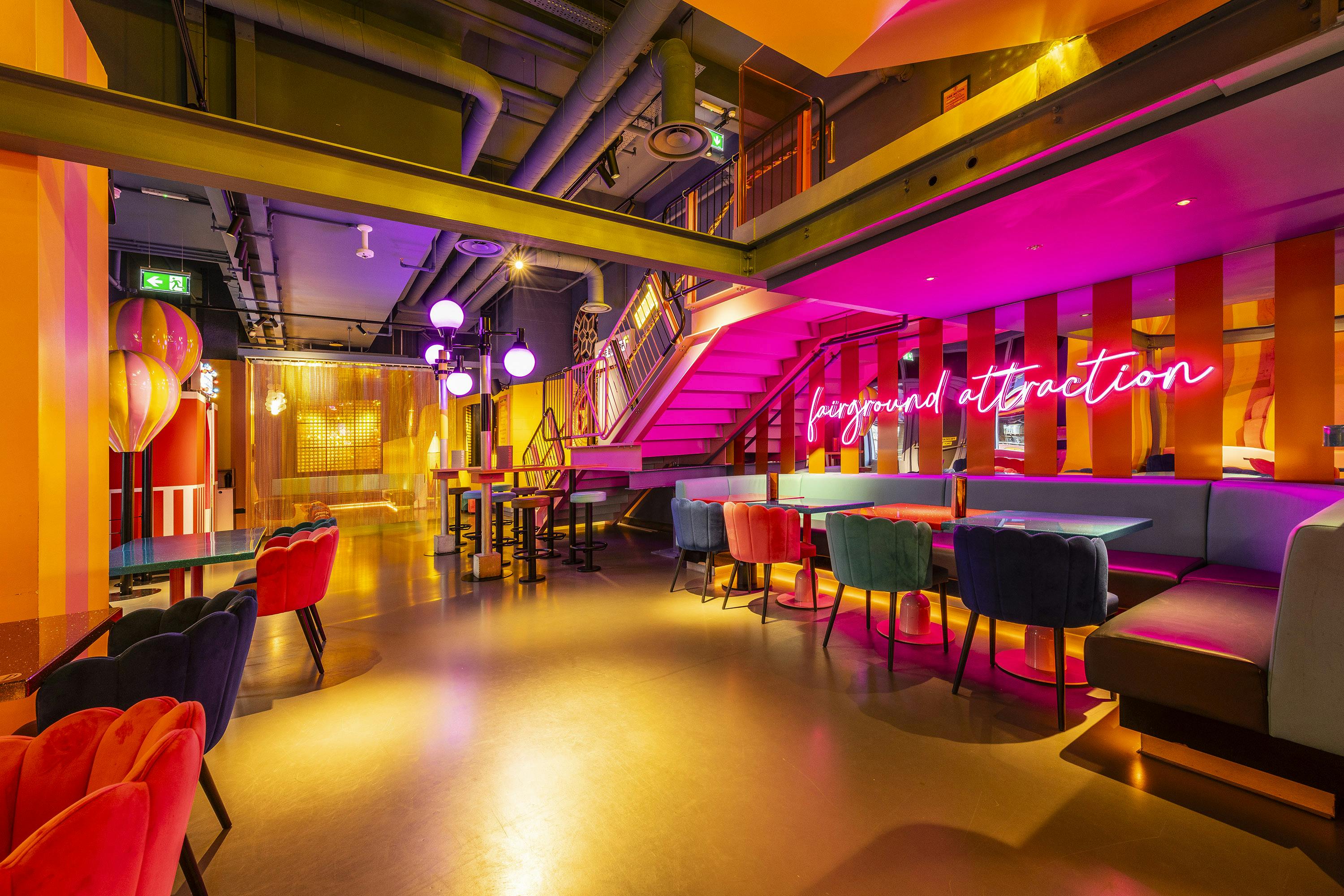 Vibrant event space with neon decor, ideal for social gatherings and networking.