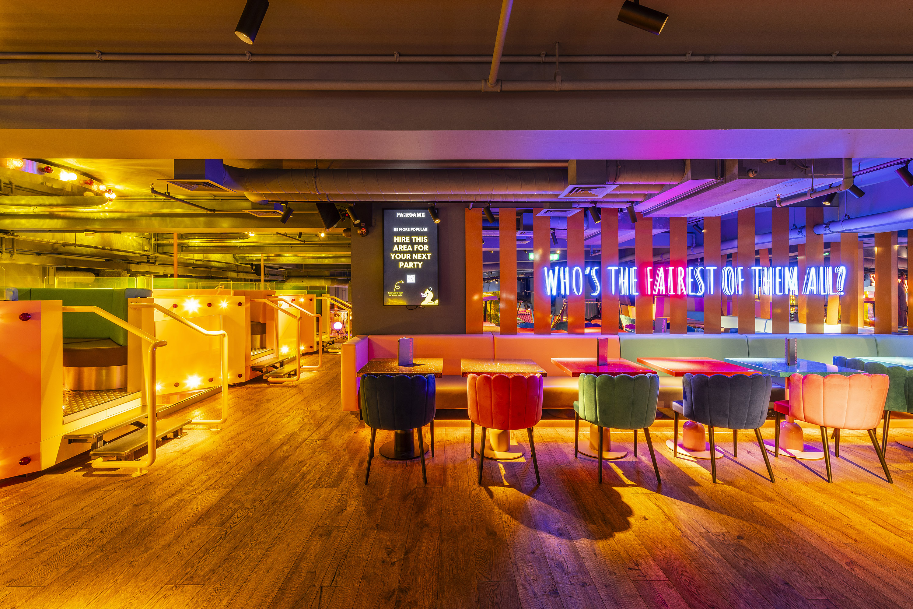 Vibrant event space with colorful seating for networking and casual gatherings. - Banner