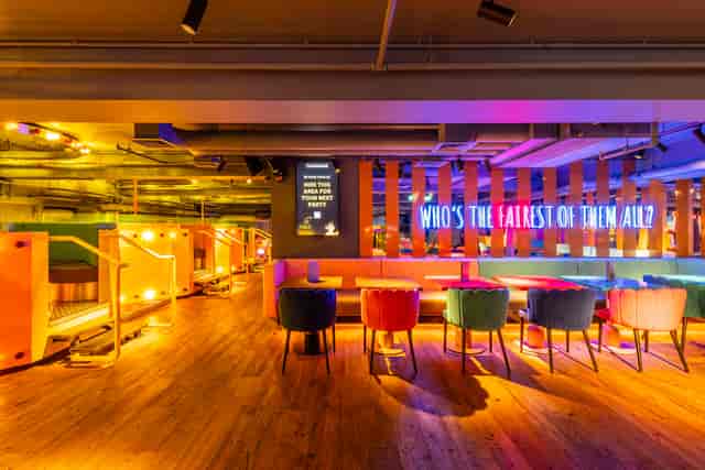 Vibrant event space with colorful seating for networking and casual gatherings.