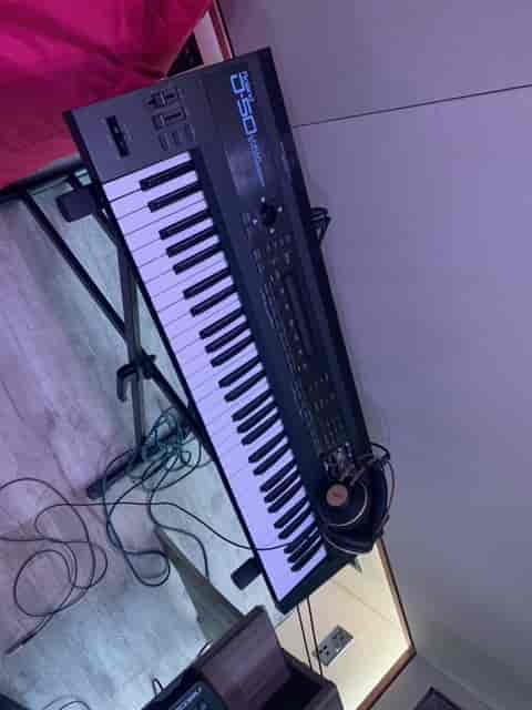 Keyboard setup with headphones for live events and creative sessions at Rollover Studios.