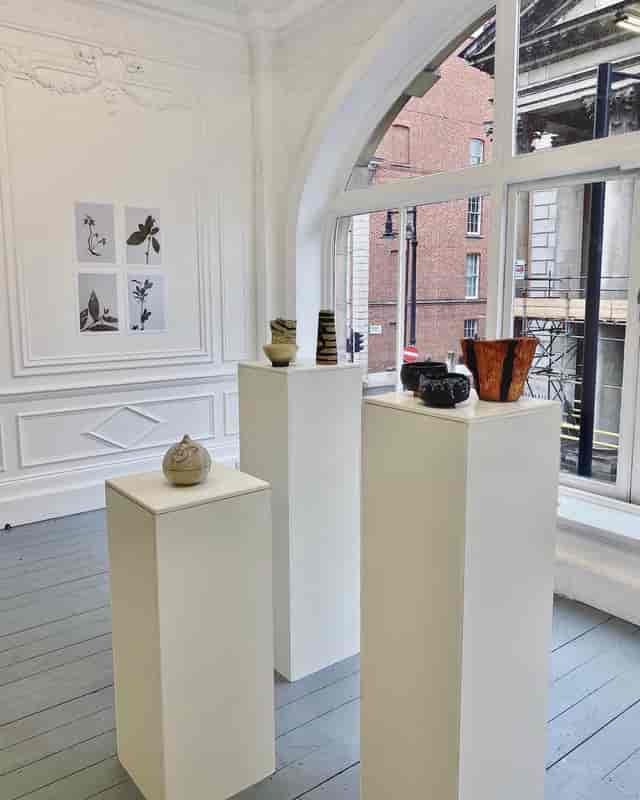 Minimalist exhibition space on Saint George Street with ceramic artworks, ideal for art events.