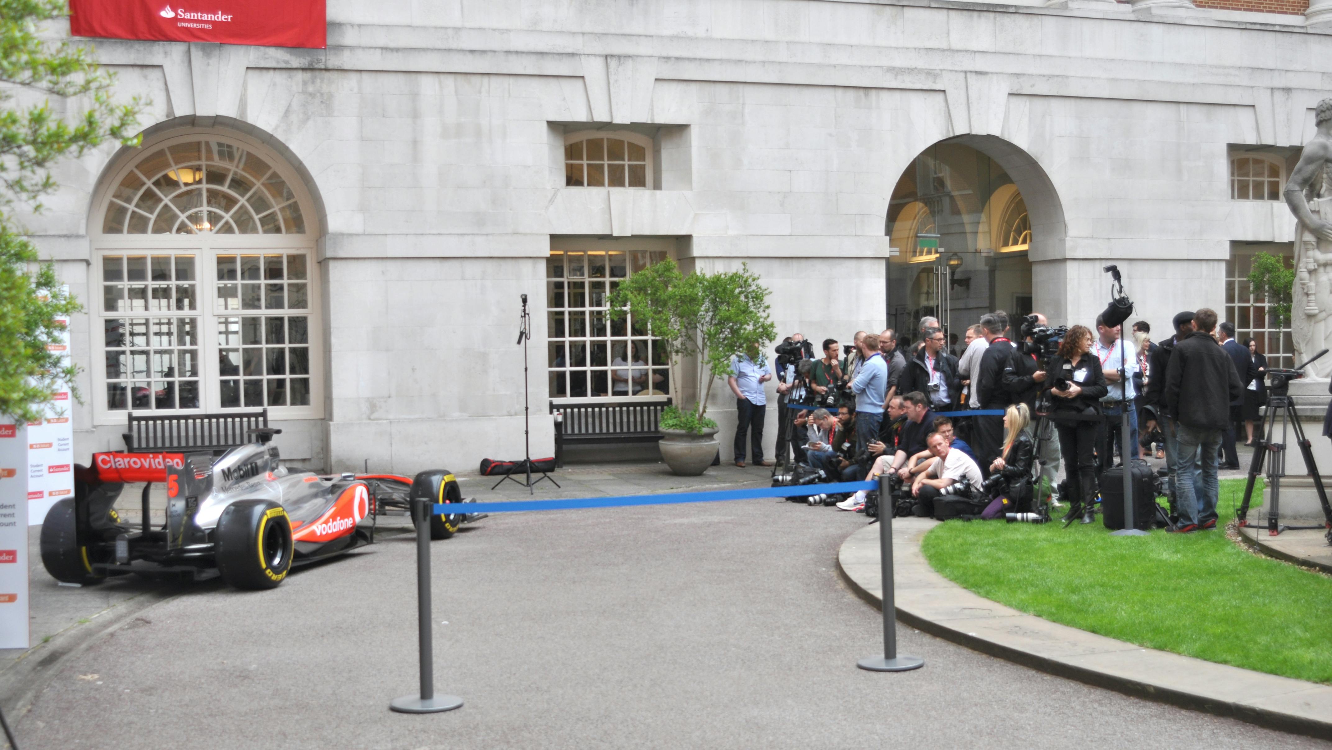 Race car launch event at BMA House with media coverage and elegant outdoor setup.