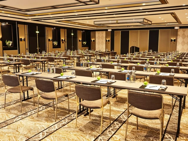 Ballroom 1 at Steigenberger Hotel, corporate event setup with modern decor and lighting.
