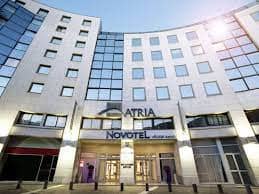 Modern Novotel Paris Sud hotel exterior, ideal for conferences and corporate events.