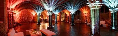 Great Hall in Guildhall: elegant event space with vaulted ceilings and vibrant lighting.