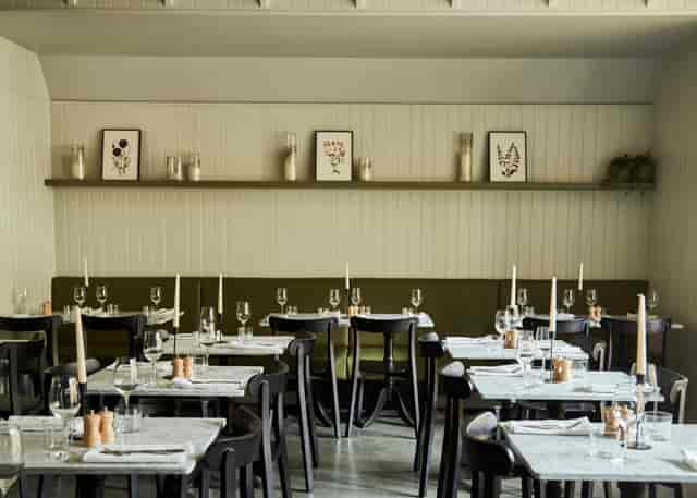 Stylish Archway Battersea restaurant with candlelit tables for events and gatherings.
