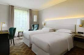 Sheraton Offenbach Hotel twin beds room for conferences and business events.