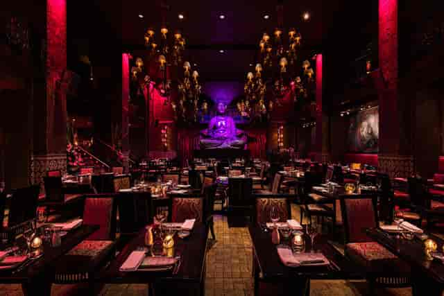 Semi-private dining space at Buddha-Bar with dramatic lighting for upscale events.