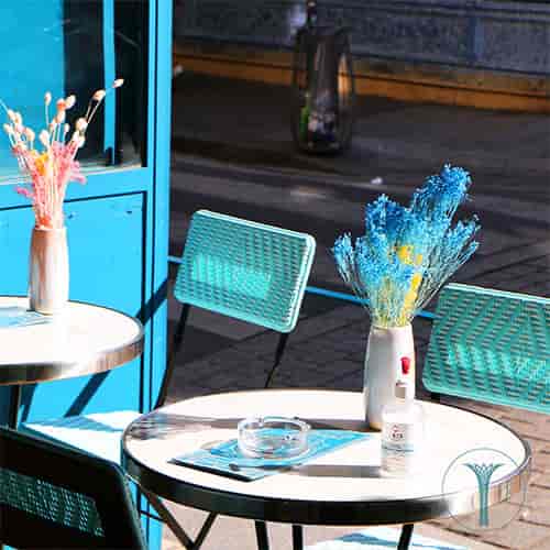Vibrant outdoor seating at La Reverie, ideal for casual meetings and networking events.