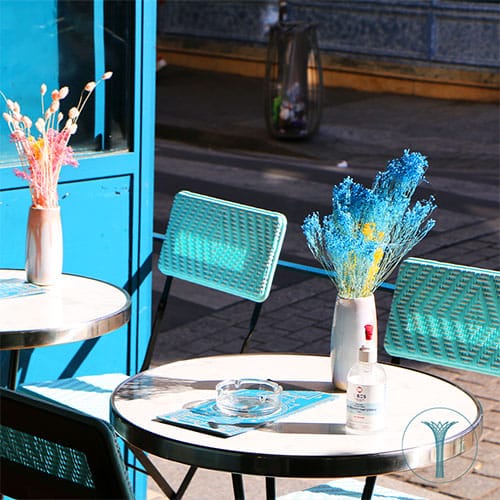 Vibrant outdoor seating at La Reverie, ideal for casual meetings and networking events.