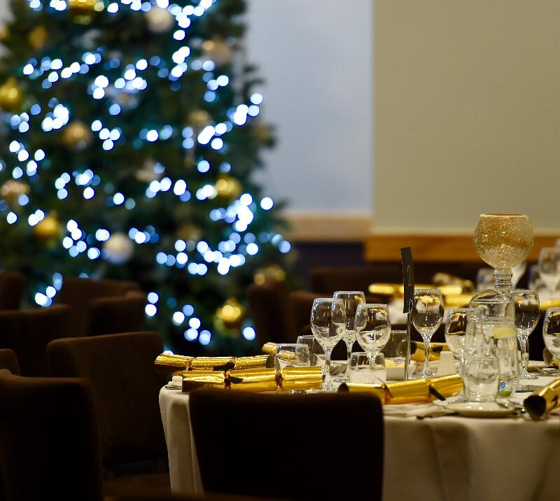 Elegant dining setup at King Solomon Hotel with festive decor for holiday events. - Banner